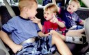 Kids buckled up in the back seat