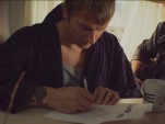 Kimi Raikkonen, eagerly signing a new sponsorship contract