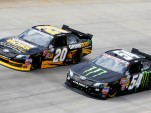 Kurt Busch (No. 54) races wtih Ryan Truex at Dover - NASCAR photo