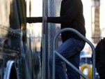 Kyle Busch enters the NASCAR trailer to learn his fate