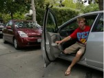 Kyle with his family Toyota Prius and the new 2010 Honda Insight he drives