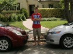 Kyle with his family Toyota Prius and the new 2010 Honda Insight he drives