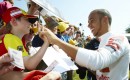 Lewis Hamilton with fans at the 2011 Goodwood Festival of Speed