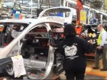 Lithium-ion battery pack installation in 2012 Ford Focus Electric at Wayne Assembly Plant