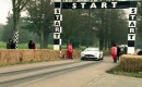 Lord March pilots the Aston Martin Vanquish up Goodwood Hill