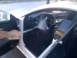 Man washes interior of 2012 Mercedes-Benz CLS