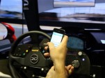 Mazdaspeed Motorsports driver Connor De Phillippi stacks a virtual race car while texting