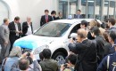 Nissan electric taxi leaving Better Place battery switching station, Tokyo, April 2010