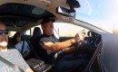 Nobuhiro 'Monster' Tajima, behind the wheel of the Tesla Model S