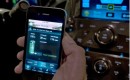 OnStar engineer demonstrates OnStar MyLink for mobile phone applications.