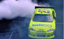 Paul Menard does a burnout in the #27 car after winning the Brickyard 400. Image via NASCAR.