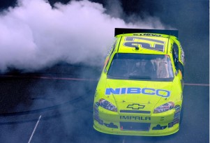 Paul Menard does a burnout in the #27 car after winning the Brickyard 400. Image via NASCAR.
