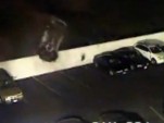 Porsche 911 crash-lands in parking space