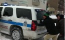Rahm Emanuel helps push a police vehicle out of the snow