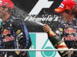 Red Bull's Sebastian Vettel and Mark Webber on the podium at the 2010 Malaysian Grand Prix