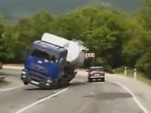 Russian driver narrowly evades rolling tanker truck