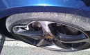Scuffed wheel of a Ferrari FF damaged by Journalist