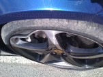Scuffed wheel of a Ferrari FF damaged by Journalist