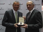TAG Heuer's Jean-Christophe Babin poses with McLaren's Ron Dennis