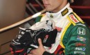 Takuma Sato with driver gloves collected for tsunami relief - Anne Proffit photo