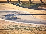 Tanner Foust drifts at Laguna Seca