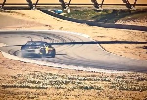Tanner Foust drifts at Laguna Seca