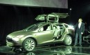 Tesla CEO Elon Musk, demonstrating the Model X third-row seat and falcon doors