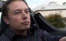 Tesla Motors CEO Elon Musk at the wheel of a Tesla Roadster