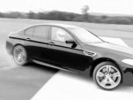 The Stig drives the 2012 BMW M5...in circles