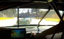 Tommy Milner closing on  a Le Mans Prototype in Baltimore's turn one