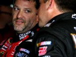 Tony Stewart confers with teammate Ryan Newman - NASCAR photo