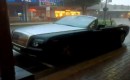 Topless Rolls-Royce Phantom Drophead Coupe in downpour