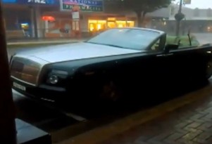 Topless Rolls-Royce Phantom Drophead Coupe in downpour