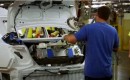 Nickel-metal-hydride hybrid battery pack being installed in trunk of new 2012 Toyota Camry Hybrid