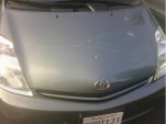 Toyota Prius with keyed hood, via Twitter account of @peterpham