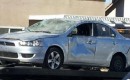 wrecked mitsubishi lancer