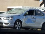 wrecked mitsubishi lancer
