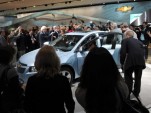 2010 Detroit Auto Show, with Speaker of the House Nancy Pelosi inspecting a 2011 Chevrolet Cruze