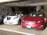 2011 Nissan Leaf and 2011 Chevy Volt, with charging station visible; photo by George Parrott