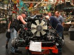Auto workers adjusting the chassis of the 2011 Chevrolet Silverado HD