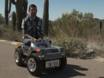 Austin Coulson riding the world's smallest car