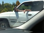 Carefree (and careless) Dodge Ram driver on the highway