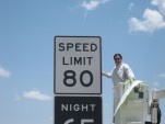 Texas legislator Pete Gallego (D-Alpine) unveils an 80 mph speed limit sign