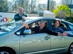 The founders of Google and one of their autonomous Toyota Prius hybrids